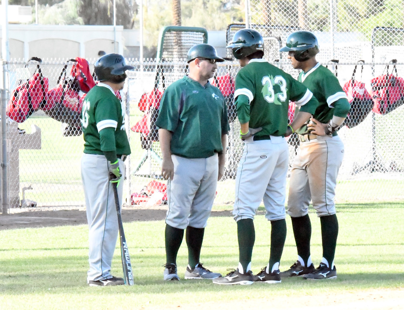 East Los Angeles College Huskies talk about a pitching change with head coach James Hines. (Photo by DeeDee Jackson)
