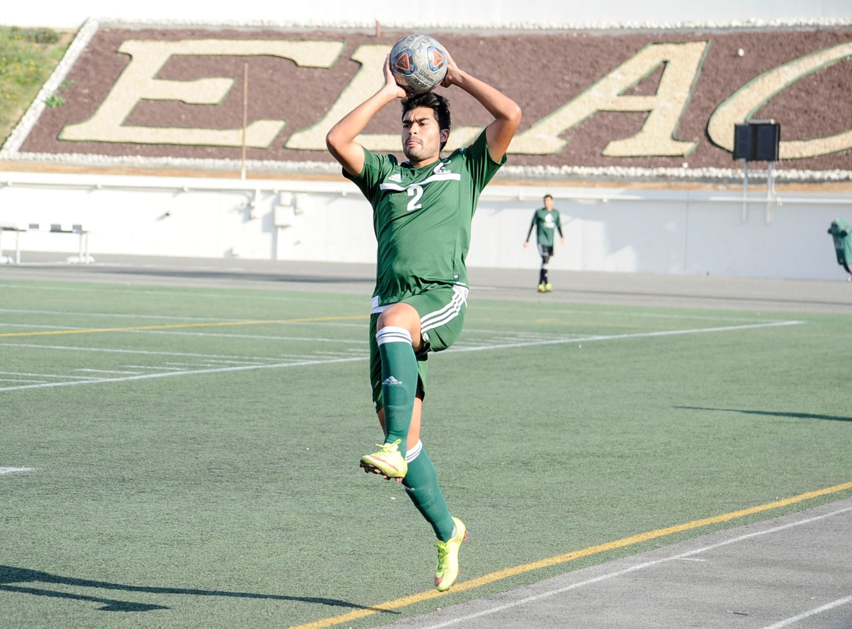 East Los Angeles College defender Andres Martinez is air bound before he comes in for a landing while he moves the ball behind his head for a throw in, in a 1-0 loss to Compton College. (Photo by Tadzio Garcia)