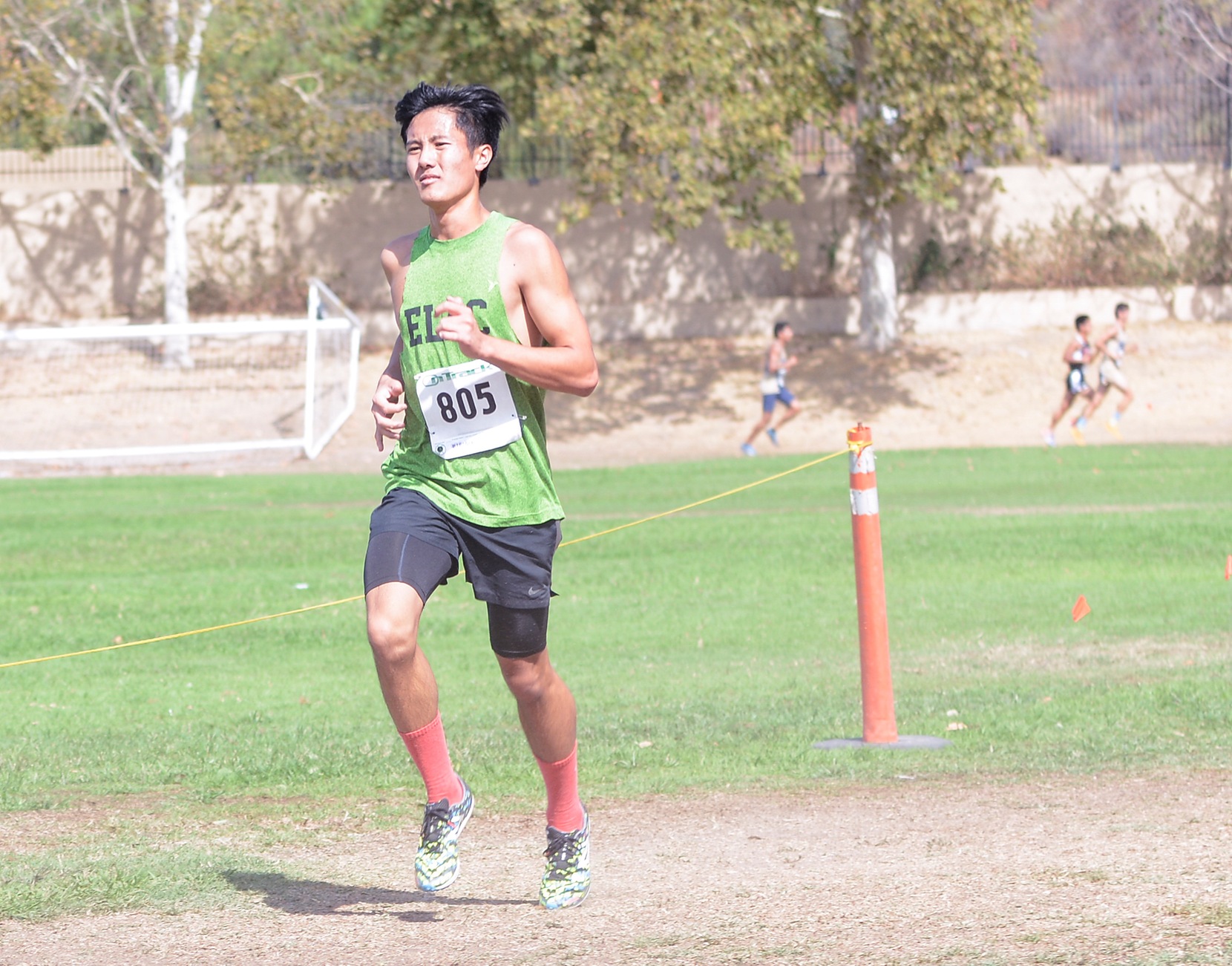 East Los Angeles College men's cross country team sophomore Allen Yeung, pictured as a freshman, gets a personal record at the Redlands Invitational helping the Huskies to their best average time per man in two years. (Photo by Tadzio Garcia)