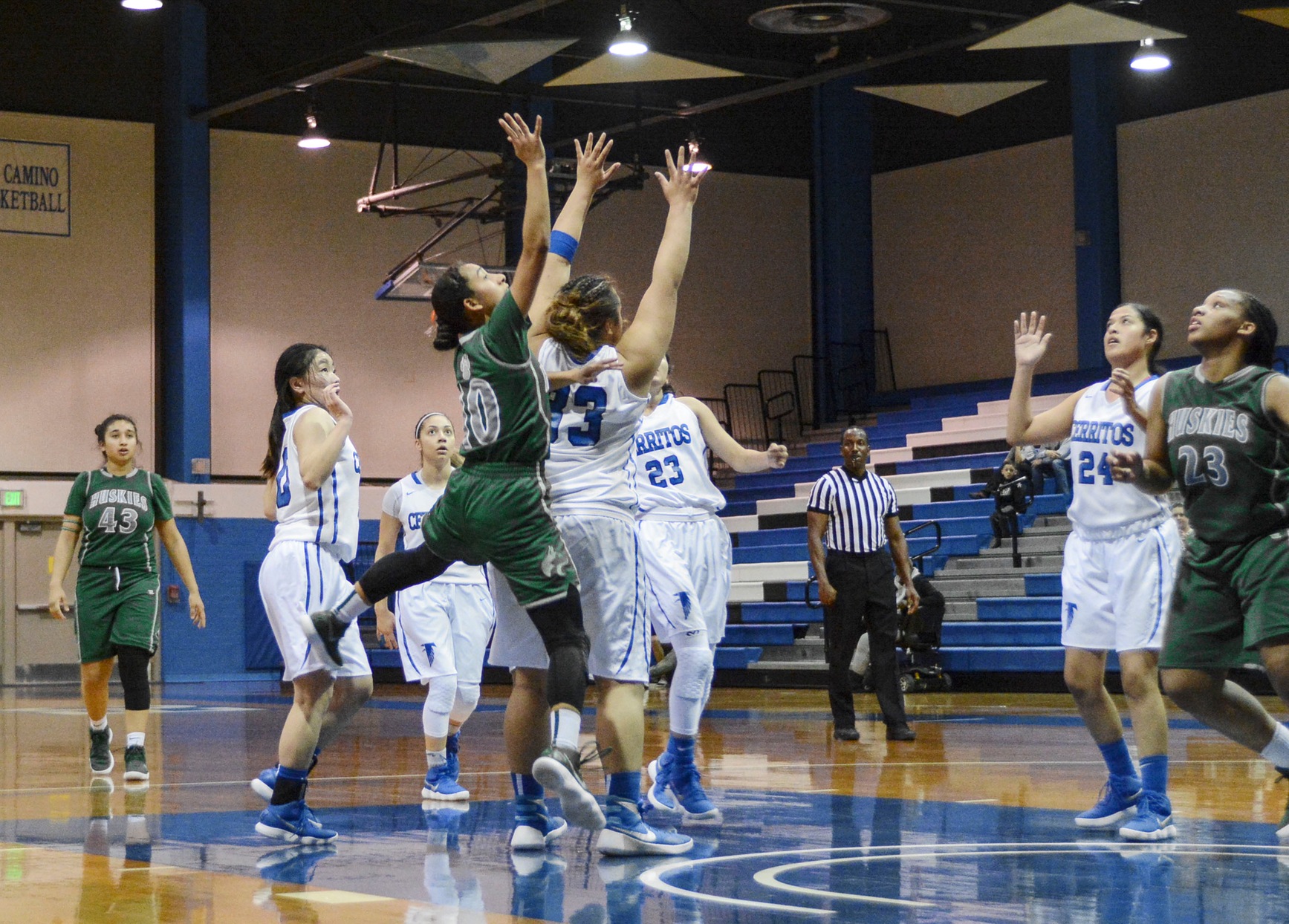 East Los Angeles College guard Jennifer Pool scores a jump shot in traffic in a 87-75 win over Cerritos College. (Photo by Tadzio Garcia)