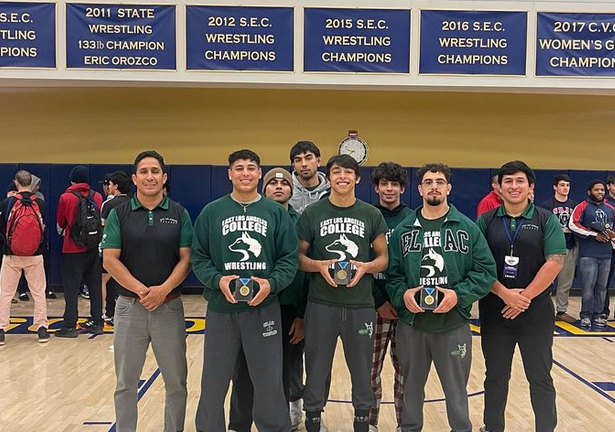 Coach Miguel Soto with the three ELAC wrestlers who earned State place finishers.