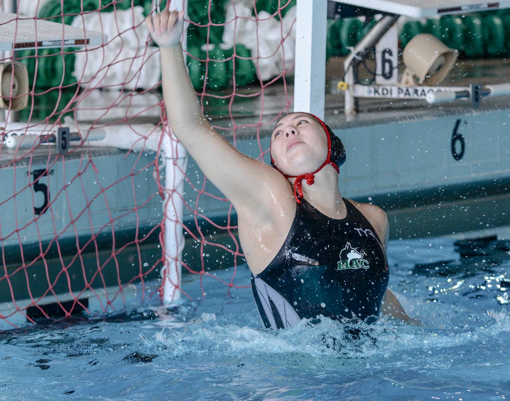 East Los Angeles College sophomore goalkeeper Krystal Ramirez (Schurr HS) pushes a goal attempt over the bar in a 15-10 Husky water polo loss to El Camino College, Wednesday Oct. 12. (Photo by Tadzio Garcia)