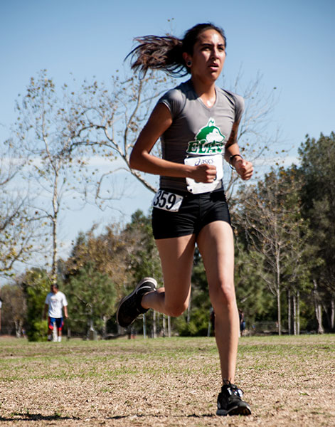 LOOK OF DETERMINATION—Freshman Rosa Arellano sprints at the finish line to score for the East Los Angeles College women’s cross country at the 2015 Golden West Classic, Friday Sept. 25, to help the team place eighth. ( Photo by  Tadzio Garcia )