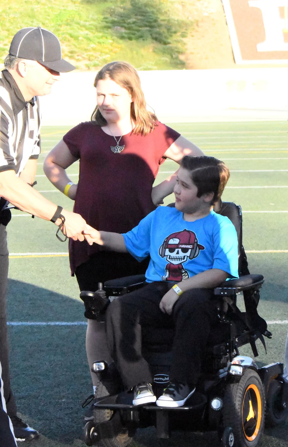 Avery Faeth is acknowledged at halftime at an East Los Angeles College football game on Sept. 24, 2016. Football coaches across America brought awareness to help defeat Duchenne Muscular Dystrophy for the Coach to Cure MD Program. (Photo by DeeDee Jackson)