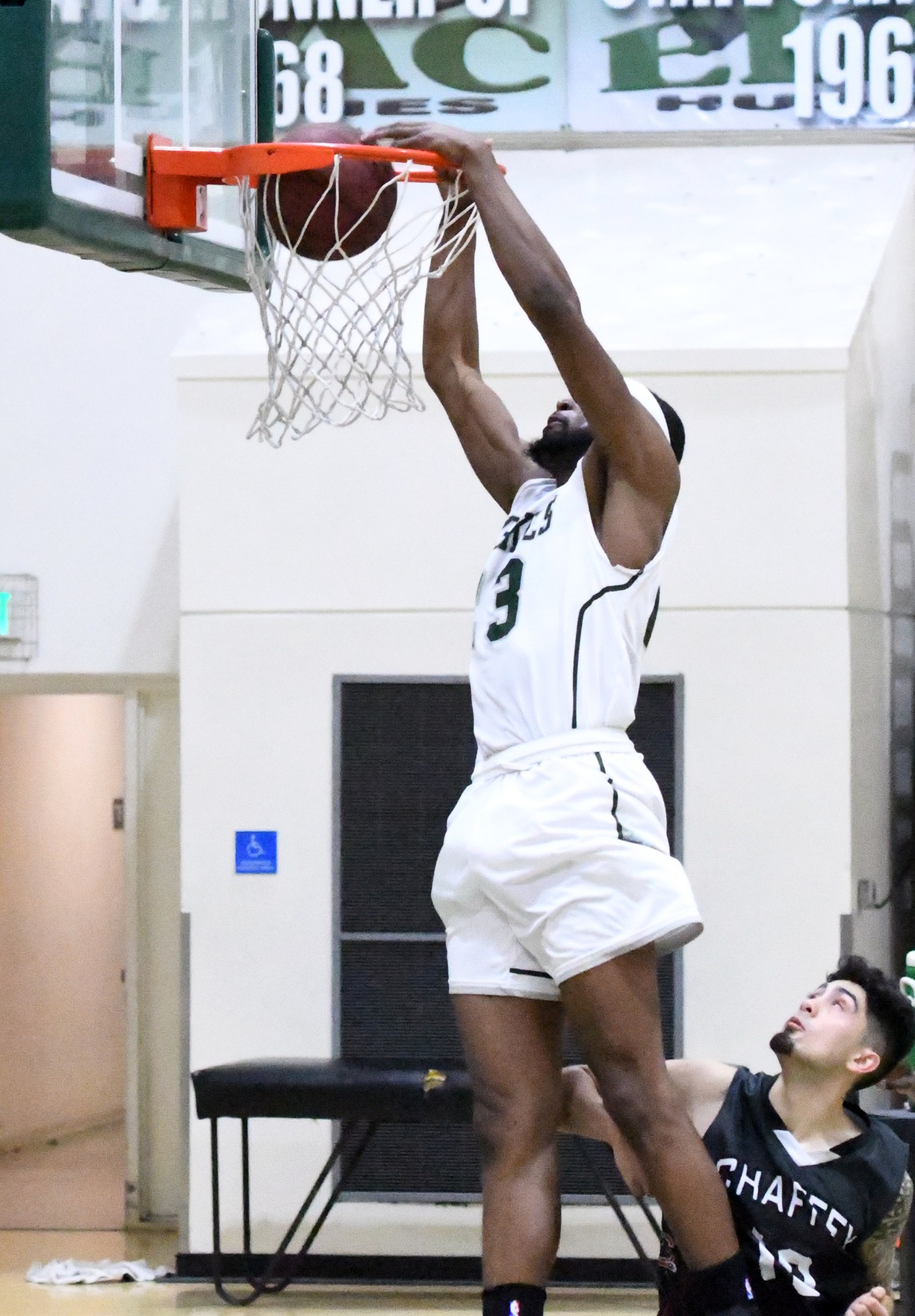 East Los Angeles College sophomore forward Roderick Williams slams his second dunk of the night in an 86-45 win over Chaffey College. (Photo by DeeDee Jackson)