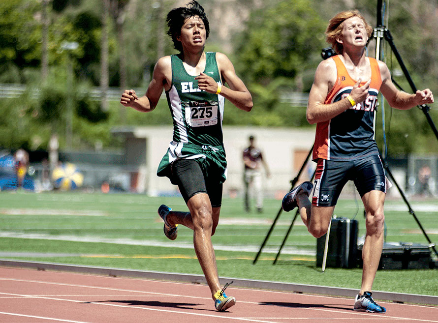 East Los Angeles College sophomore Cristian Flores competes in the men's 3,000-meter steeplechase run. (photo by Tadzio Garcia)