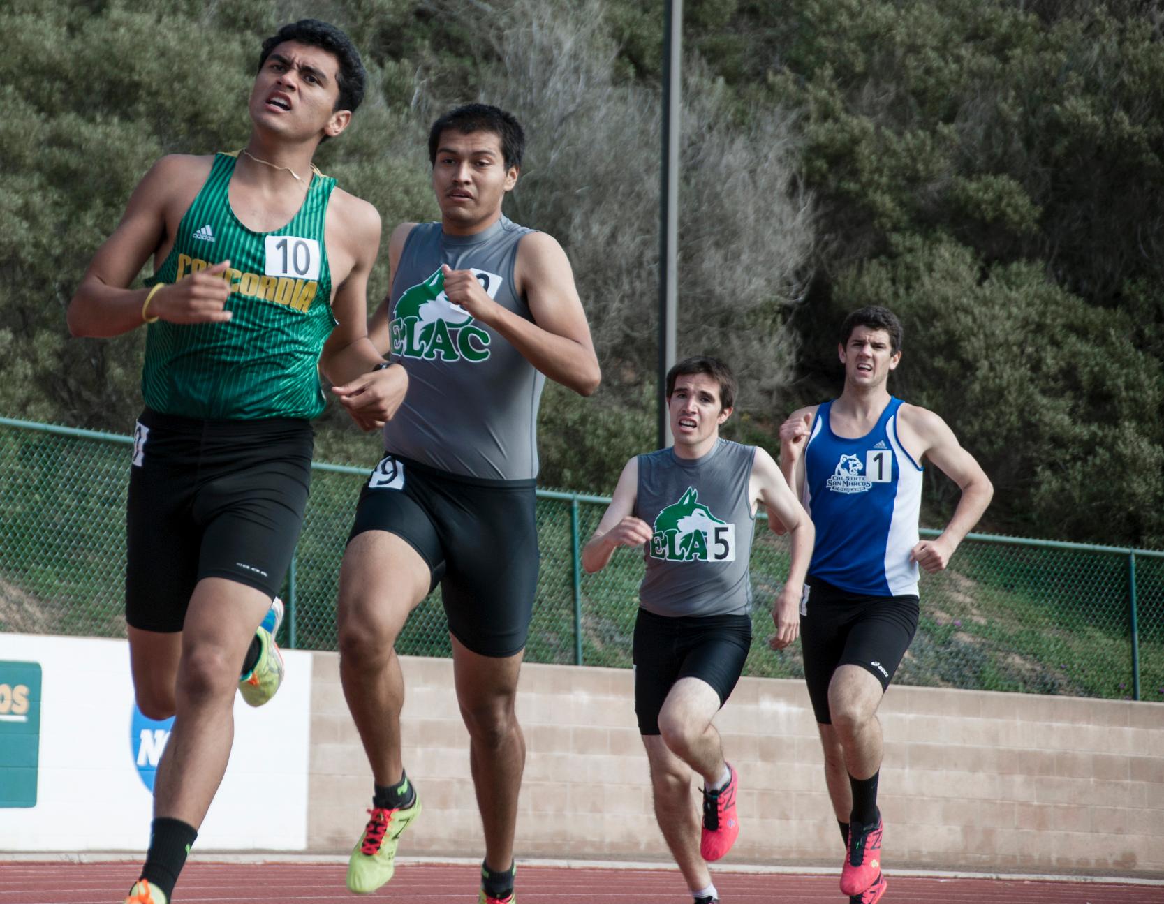 East Los Angeles College sophomores Augustine Arias, center left, and Fernando Jauregui run the last lap in the 800-run at the 2016 Ross and Sharon Irwin Collegiate Meet at Point Loma Nazarene University in San Diego on March 19.