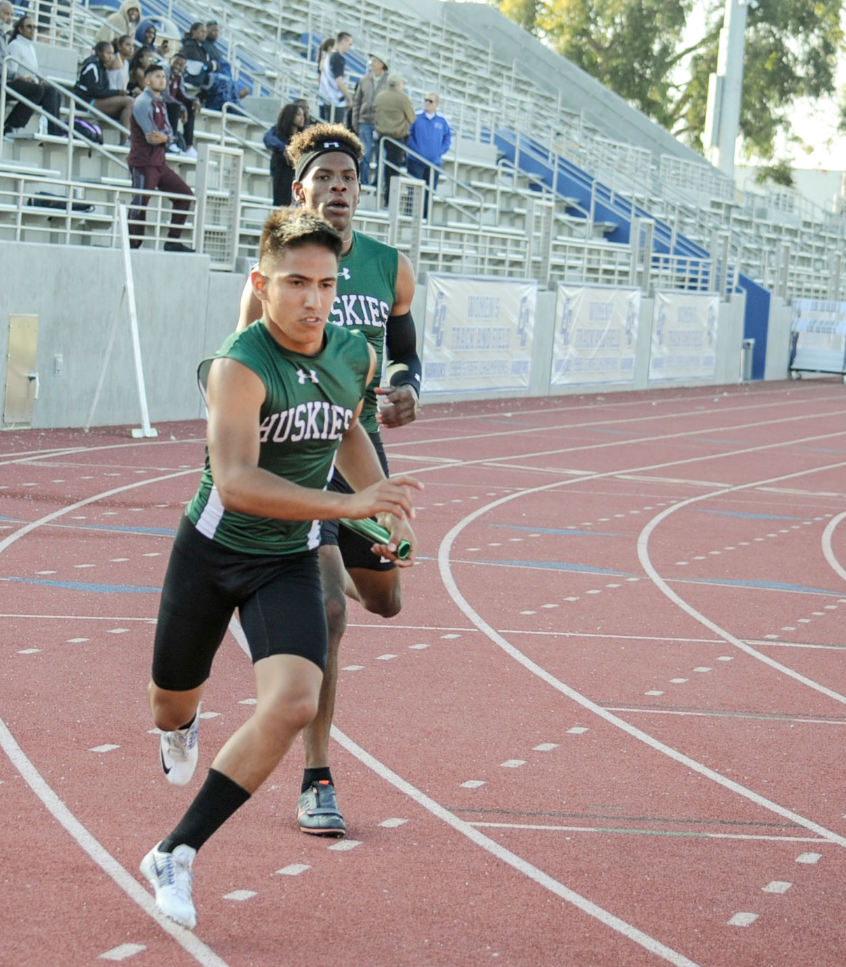 East Los Angeles College Hector Gutierrez takes the baton from Joshua Taylor in the men's 4 x 100-meter relay team at the 2018 SoCal Championship Prelims at San Diego Mesa College. (Photo by Tadzio Garcia)
