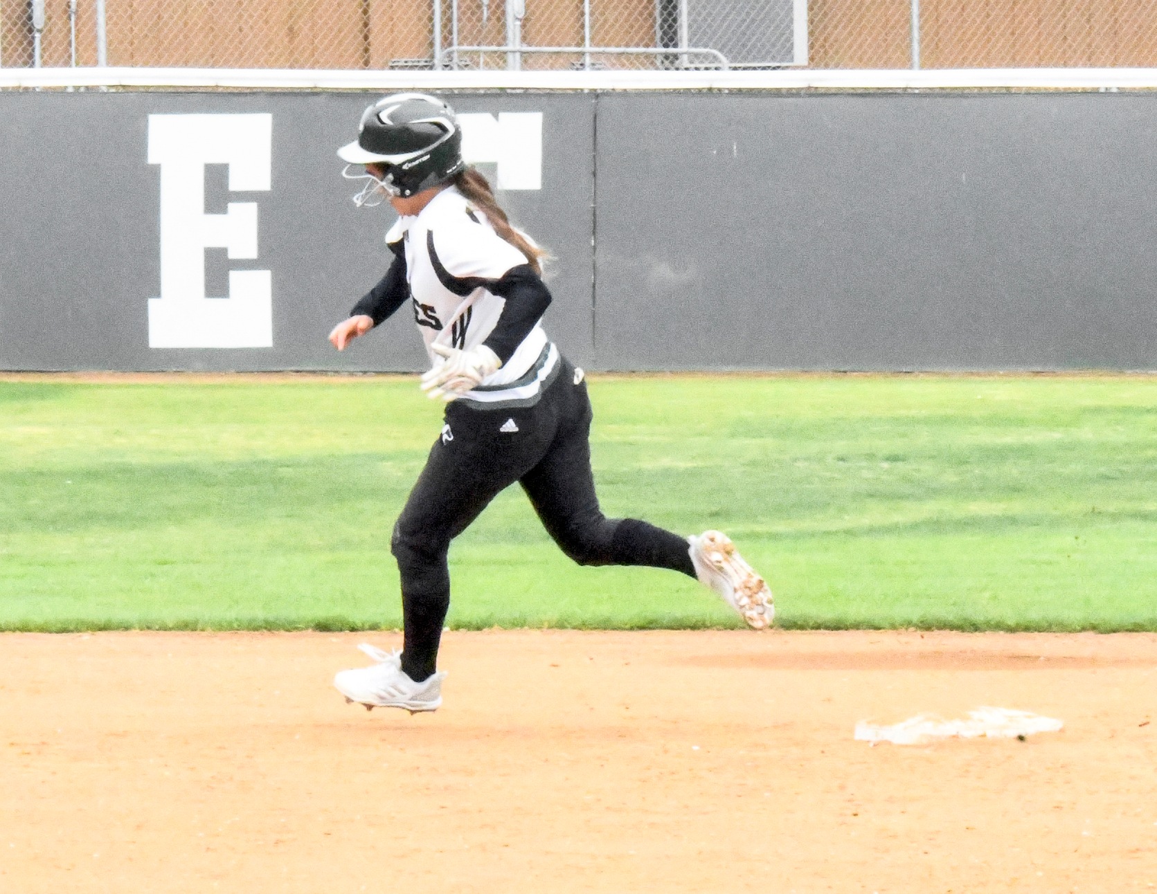 The East Los Angeles College softball team split four games in the Mt. San Jacinto Tournament including a 2-1 win over Santa Barbara City College and an 11-5 win over Grossmont College. Natalie Acosta, pictured, is rounding second base. (Photo by DeeDee Jackson)