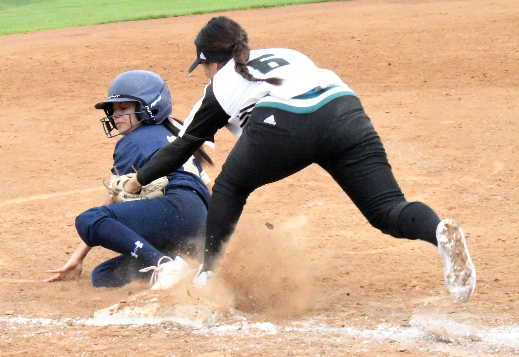 East Los Angeles College sophomore Destiny Avena tries to tag LA Harbor College's Natalie Saucedo at third base in a 9-5 Huskies win over the Seahawks. (Photo by DeeDee Jackson)