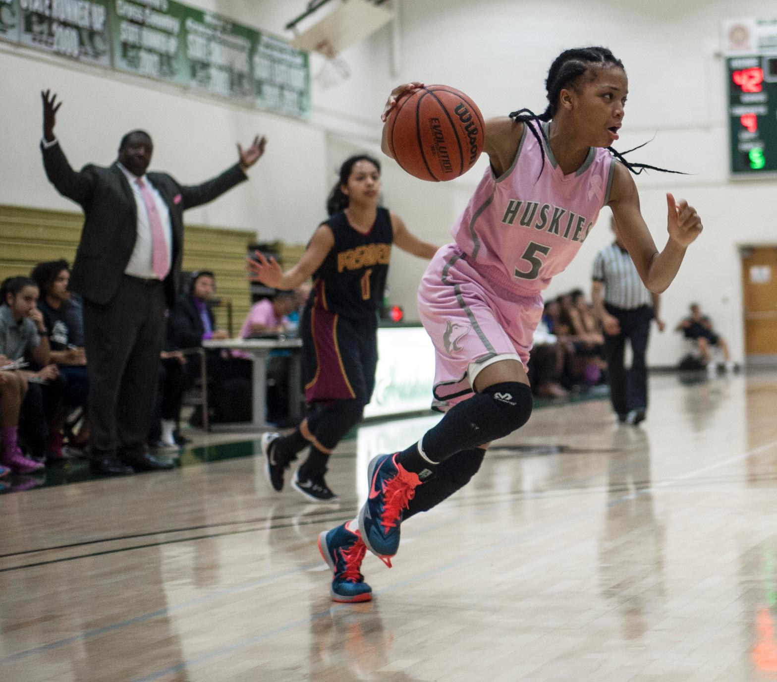 COMING AROUND THE CORNER—East Los Angeles College women's basketball freshman guard Brianne Cheatum drives towards the paint in a 77-53 loss to Pasadena City College on Feb. 12. (Photo by Tadzio Garcia)