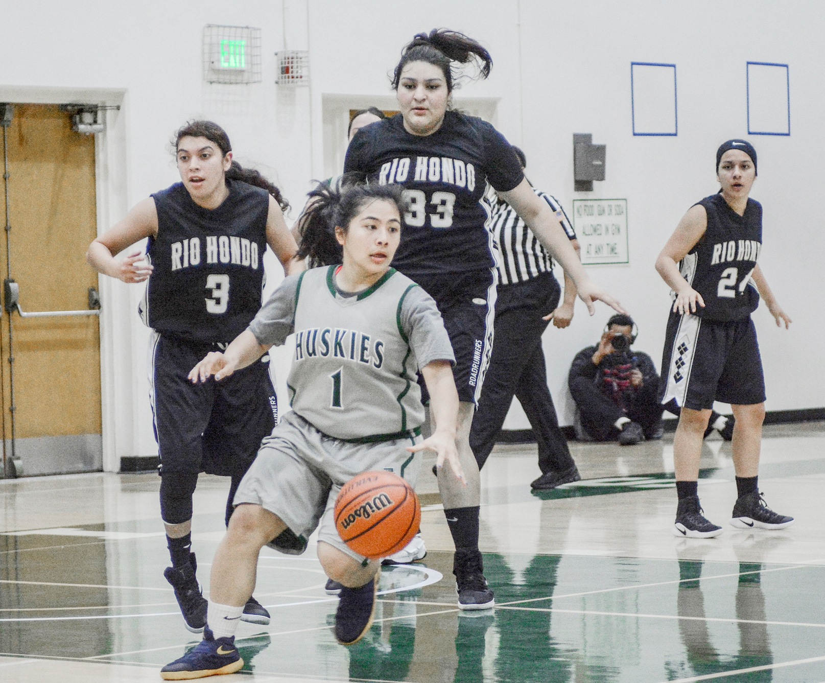 East Los Angeles freshman guard Farrah Castillo gets a rebound surrounded by taller Rio Hondo players in a 67-41 Husky win on Feb. 8. (Photo by Tadzio Garcia)