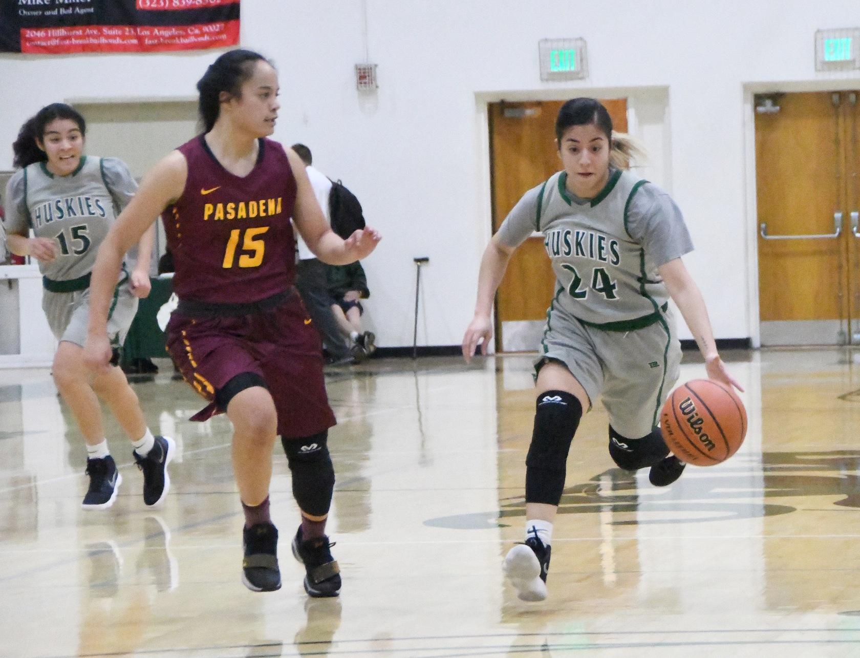 East Los Angeles guard Destinee Anaya runs a fast break by Pasadena's Merina Latu after a steal in a 64-56 over Pasadena City College. (Photo by DeeDee Jackson)