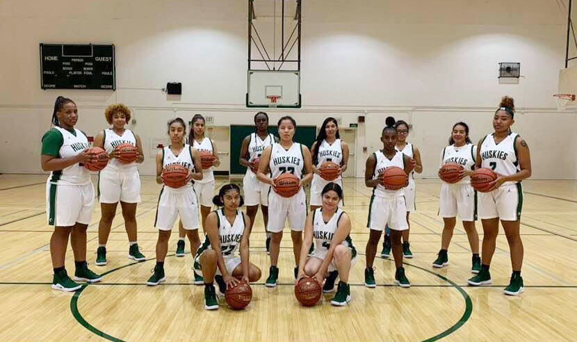 Photo of the Lady Huskies 2018-19 women's basketball team photo courtesy of Sarai Trinidad.