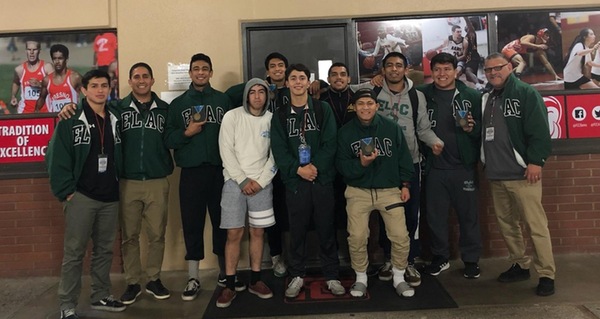 Coach Valle (right) pictured with the ELAC Wrestling team at the 2019 State Championships.