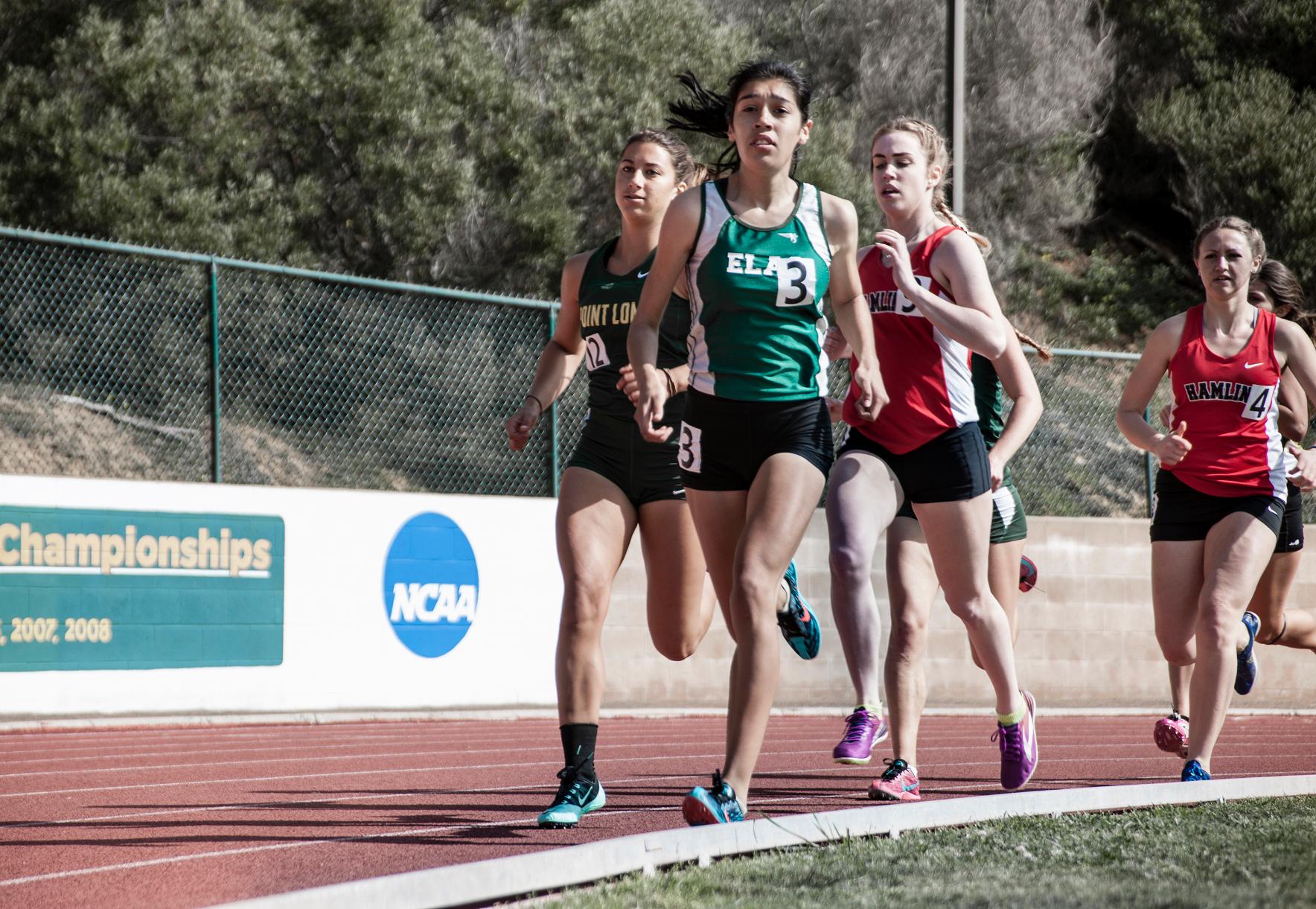 East Lost Angeles College sophomore Ruby Padilla leads the 1,500-meter run in a collegiate meet at Point Loma Nazarene University on March 19.