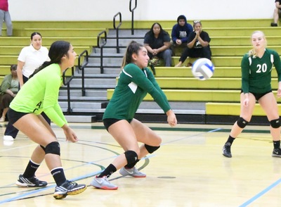 East Los Angeles College volleyball freshman outside hitter Bela Gamboa gets a key dig. (Photo by DeeDee Jackson)