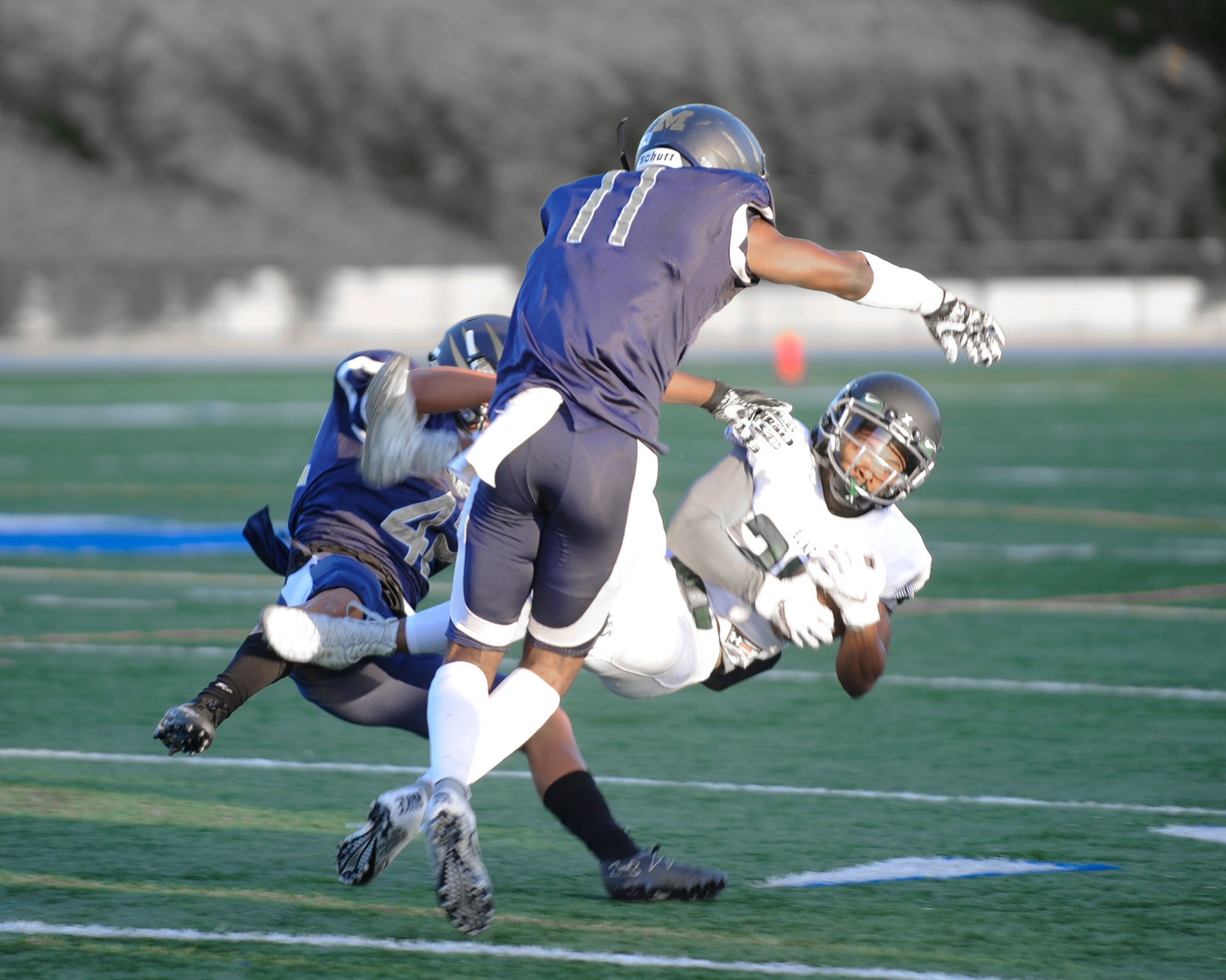 East Los Angeles College sophomore wide receiver Antoise Fields' air bound acrobats hauls in a pass in a 21-13 Huskies win at San Diego Mesa. (Photo by Tadzio Garcia)
